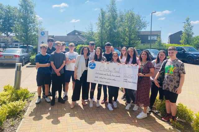 Lodge Park Academy students with the donation to Mind