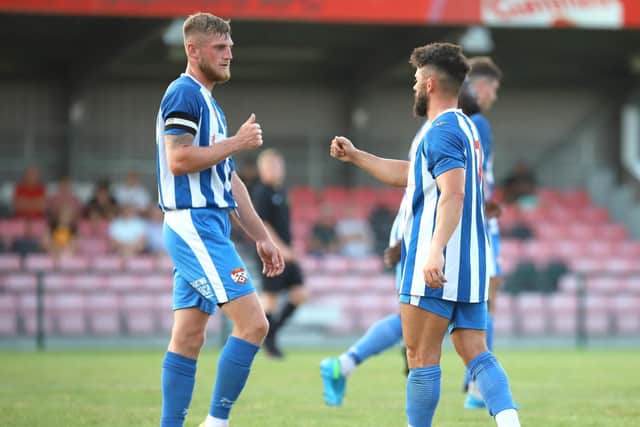 Connor Kennedy, who wore the captain's armband, congratulates Callum Powell after his equaliser