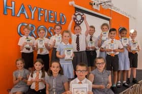 The children at Hayfield Cross Primary School with their shield from the Building Buddies award