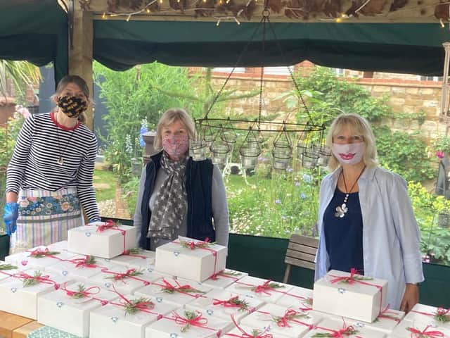 A group of friends has raised £3,000 for three charities by making and delivering afternoon tea boxes.