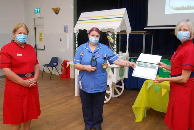 Staff nurse Donna Fahy receives her award from L-R Deputy Director of Nursing and Quality, Diane Postle, and Director of Nursing and Quality Leanne Hackshall.