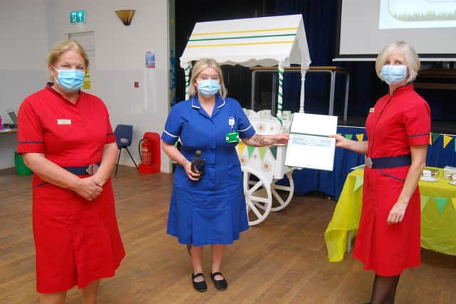 Midwife Jodie Guyver receives her award from L-R Deputy Director of Nursing and Quality, Diane Postle, and Director of Nursing and Quality Leanne Hackshall.