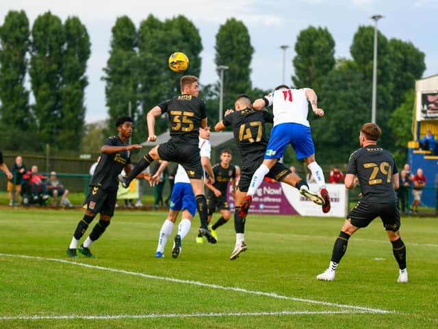 Ben Diamond rises to head home AFC Rushden & Diamonds' opening goal in their 3-1 victory over a youthful Northampton Town side on Tuesday. Pictures courtesy of Hawkins Images