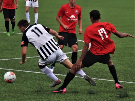 Action from Corby Town's final pre-season friendly of the summer as they claimed a 2-0 win at Eastwood CFC. Picture by David Tilley
