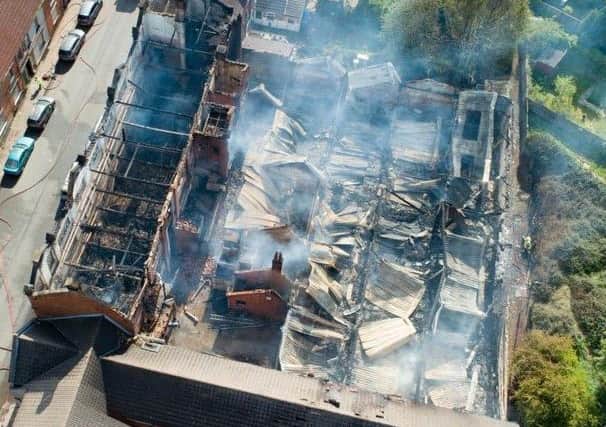 Two roads closed and residents evacuated following fire at Kettering Bedding Centre building., Regent Street, Kettering Monday 13 May 2019. Picture by Terry Harris.