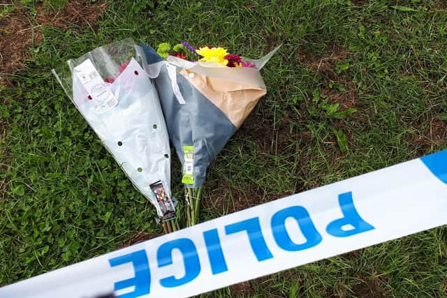Floral tributes have been left at the scene