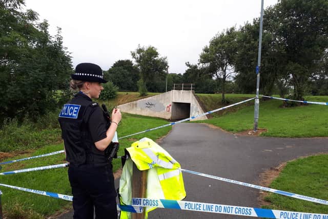 Police at the scene of an underpass by Shelley Road.