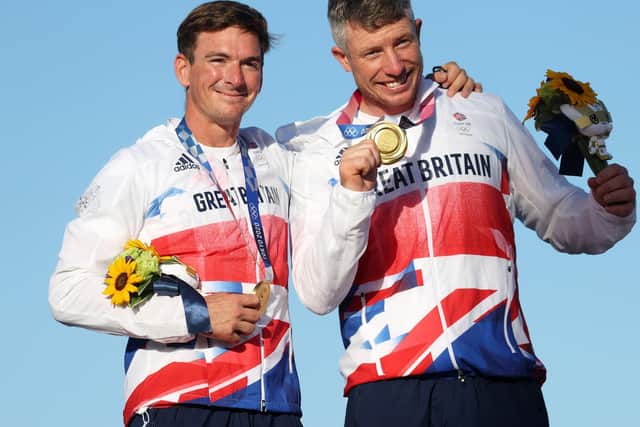 l-r Dylan Fletcher and Stuart Bithell of Team Great Britain pose with their gold medals for the Men's Skiff 49er class on day eleven of the Tokyo 2020 Olympic Games at Enoshima Yacht Harbour on August 03, 2021 in Fujisawa, Japan. (Photo by Phil Walter/Getty Images)