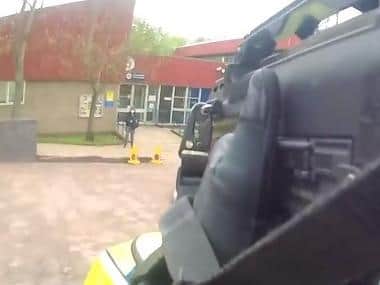 Officers arrived at Weston Favell police station to find Thanki outside with a rucksack strapped to his chest