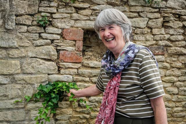 Brenda Lofthouse who spent more than 41 hours scraping ivy off six high walls spotted another piece she had to get rid of at the opening event.
