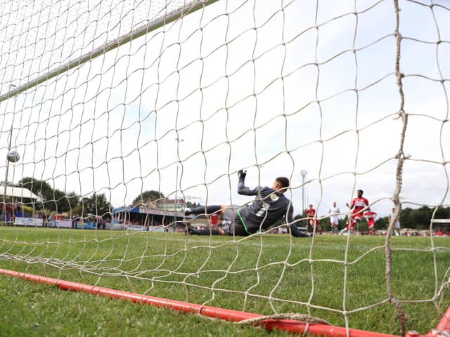 Claudio Ofosu sends Bradford (Park Avenue) goalkeeper Johnny Saltmer the wrong way from the penalty spot for what proved to be the winning goal in Kettering Town's opening-day success at Latimer Park. Pictures by Peter Short