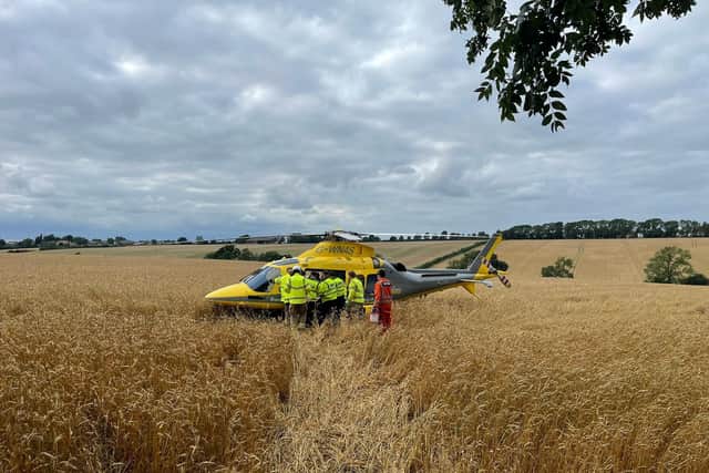 An air ambulance is on the scene of the collision on the A509. Credit: Northants Road Crime Team