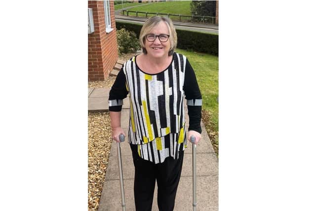 Cathy can now walk again with a stick