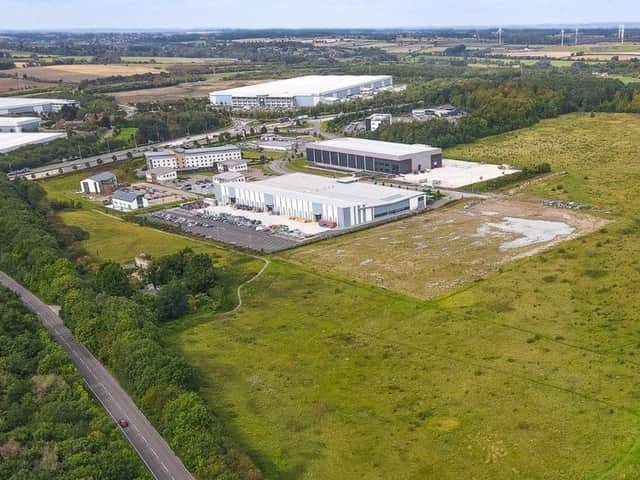 The site from above. The new warehouse would be built on the cleared site to the right of the warehouse pictured. Picture by Adam Riley