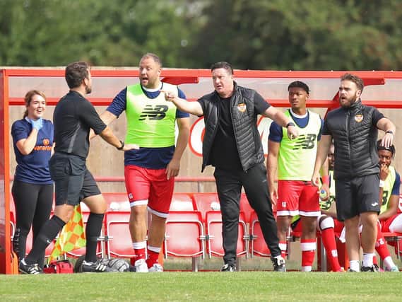 Paul Cox shares his thoughts with one of the assistant referees during Kettering Town's 1-1 draw with Farsley Celtic. Pictures by Peter Short