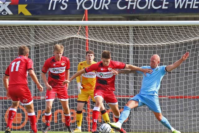 Max Dyche defends the Poppies goal during the draw with Farsley