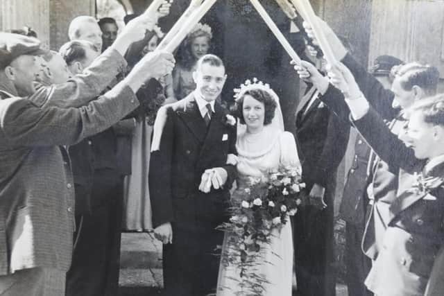 The happy couple emerge from the church at Melchbourne