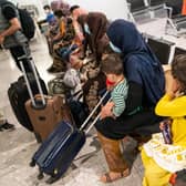 Refugees arriving at Heathrow Airport. Photo: Getty Images.