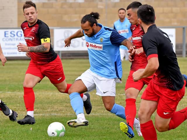 Action from Rothwell Corinthians' 3-2 defeat at Rugby Town last weekend. Picture by Martin Pulley