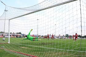 Callum Powell scores Kettering Town's equaliser from the penalty spot as they drew 1-1 with AFC Fylde at Latimer Park. Picture by Peter Short
