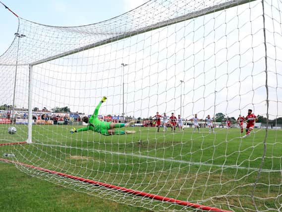 Callum Powell scores Kettering Town's equaliser from the penalty spot as they drew 1-1 with AFC Fylde at Latimer Park. Picture by Peter Short
