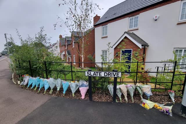 Floral tributes left outside the Slate Drive home