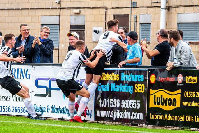 On loan striker Niall Towle celebrates after his spectacular goal, which earned Corby Town a 1-0 win over Hendon in the Emirates FA Cup. Pictures by Jim Darrah