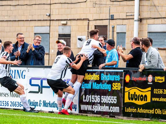 On loan striker Niall Towle celebrates after his spectacular goal, which earned Corby Town a 1-0 win over Hendon in the Emirates FA Cup. Pictures by Jim Darrah