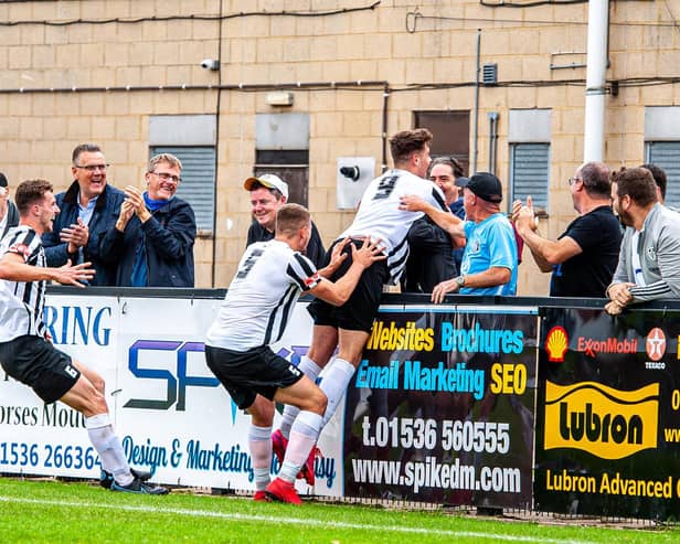 On loan striker Niall Towle celebrates after his spectacular goal, which earned Corby Town a 1-0 win over Hendon in the Emirates FA Cup. Pictures by Jim Darrah