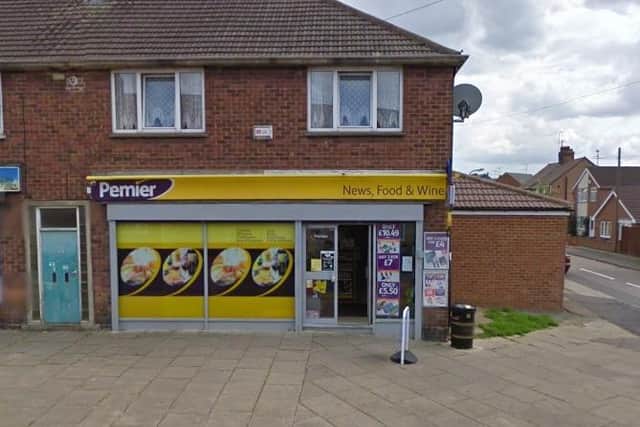 The Premier Store Walker is accused of robbing.