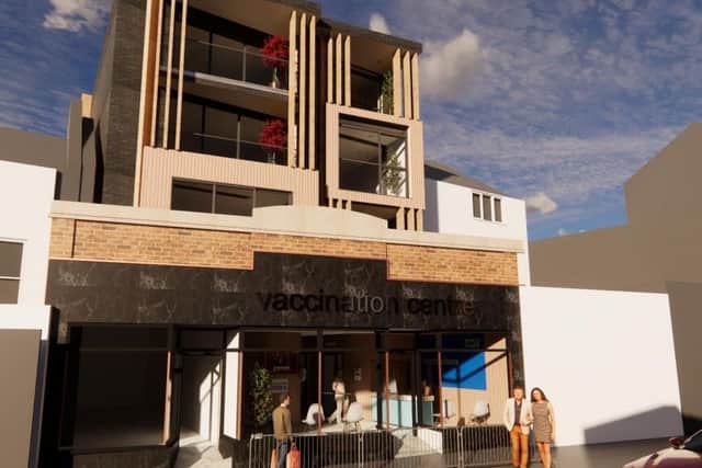 A computer generated image of the vaccination centre and flats