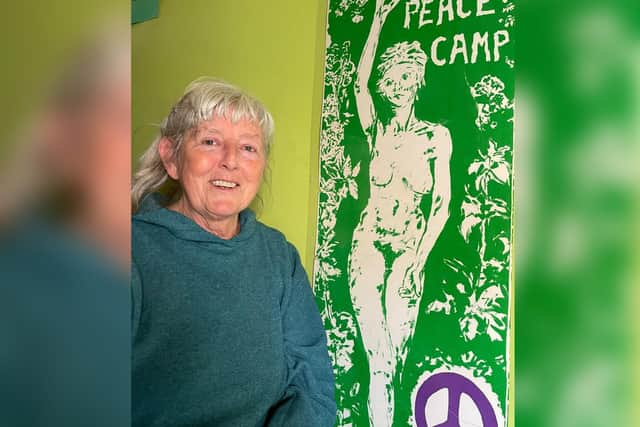 Paula and a banner designed by Corby women to take to the Greenham Common peace camp