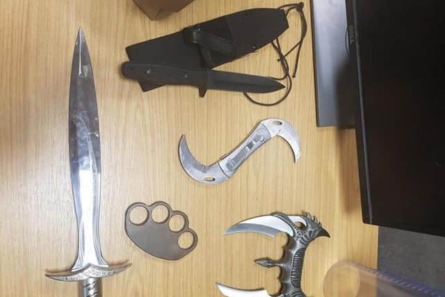 Other weapons found included a sword, sheath knife and knuckle duster