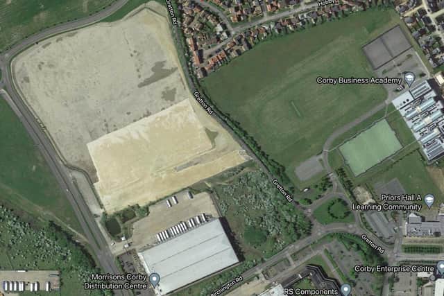 The site, with Hobby Drive at the top, and Corby Business Academy and Priors Hall primary to the right of the picture.