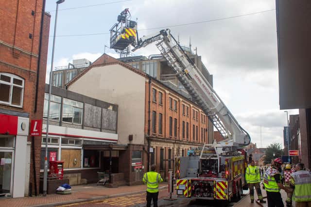 Four fire appliances rush to the blaze at the four-storey block of flats in Midland Road.