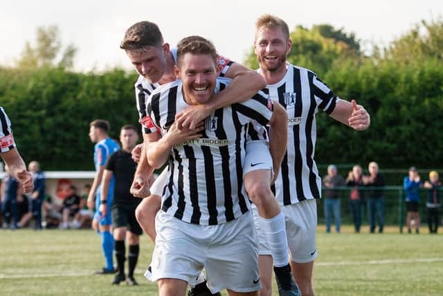 Elliot Sandy celebrates his goal during Corby Town's 3-0 win at Yaxley. Picture by Jim Darrah