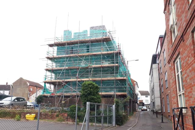 The fifth floor was started unlawfully - planning permission was granted on appeal for four storeys and nine apartments