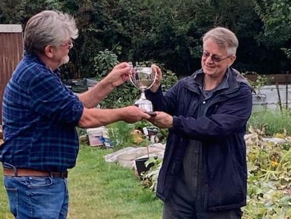 The Bridgstock Cup Award for the best allotment in Kettering was presented by Kettering Allotment Society chairman Clive Thorley to Russell Attwood at Scott Road allotments.