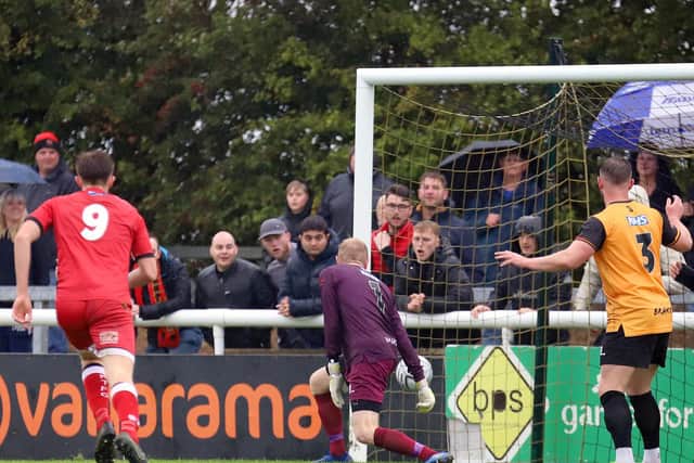 One of Kyle Perry's two goals finds the net during the Poppies' clash at Leamington