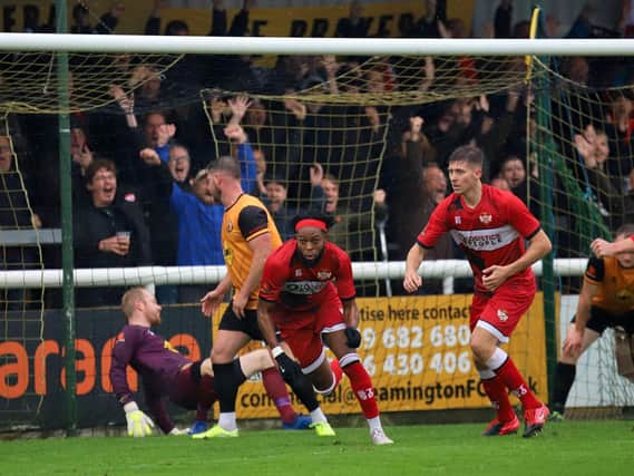 Claudio Ofosu heads off to celebrate after he scored Kettering Town's first goal in the 3-3 draw at Leamington in the FA Cup. Pictures by Peter Short