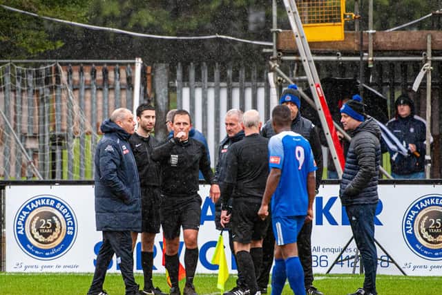 Referee Ashley Allen brought proceedings to a halt due to a waterlogged pitch at Steel Park after consulting with both managers. Pictures by Jim Darrah