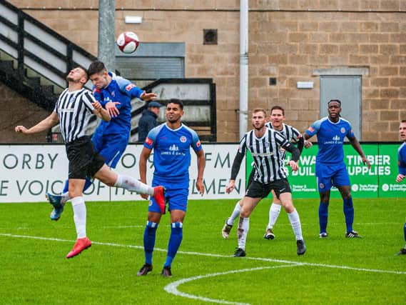 Action from Corby Town's match with Sutton Coldfield Town, which was abandoned after 20 minutes due to a waterlogged pitch at Steel Park. Picture by Jim Darrah