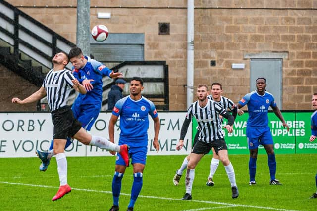 Action from Corby Town's match with Sutton Coldfield Town, which was abandoned after 20 minutes due to a waterlogged pitch at Steel Park. Picture by Jim Darrah
