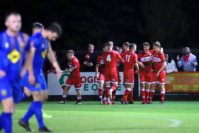Isaac Stones takes the congratulations after he came off the bench to score the Poppies' second goal on Tuesday night