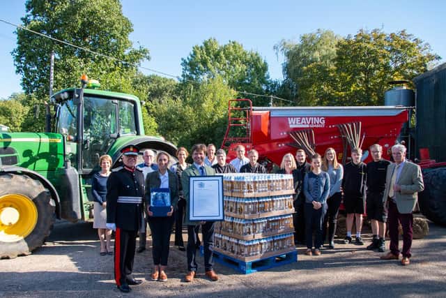 Lord Lt James Saunders Watson with the Farrington Oils team at their headquarters in Hargrave