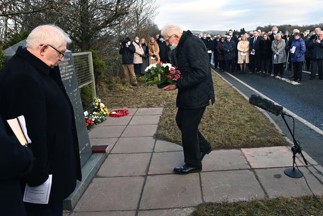 Laying a floral tribute at the memorial. Picture:  Colm Lenaghan/Pacemaker Press