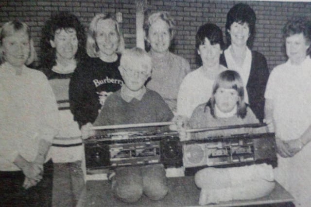Pupils and teachers from Dunfane School with some of the radio casssette players which were presented to school. 1989