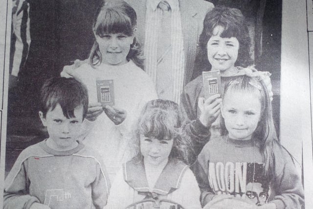 Mr Brian Millar with prizewinners in the Northern Bank competition at Cloughmills Fair - Elaine and Lynette Forsythe, Darren Morrison, Helena Hughes and Michelle Crawford.1989