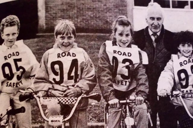 Ken McKee (chair of Ballymena Road Safety Committee) with some of the competitors in the annual Cycling Proficiency Competition at Dunclug High School.
1989