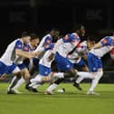 The ecstatic AFC Rushden & Diamonds' players celebrate after the winning penalty hit the net (Picture: Peter Short)